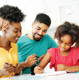 Parents teaching child how to balance funds