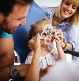 Child happily takes eye exam