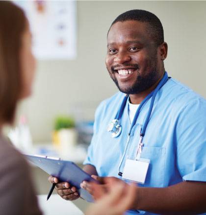 Octapharma staff happily assists donor in center