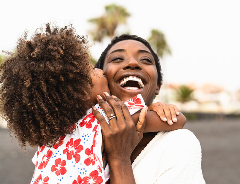 Warm embrace between mother and child, seemingly happier from plasma treatments