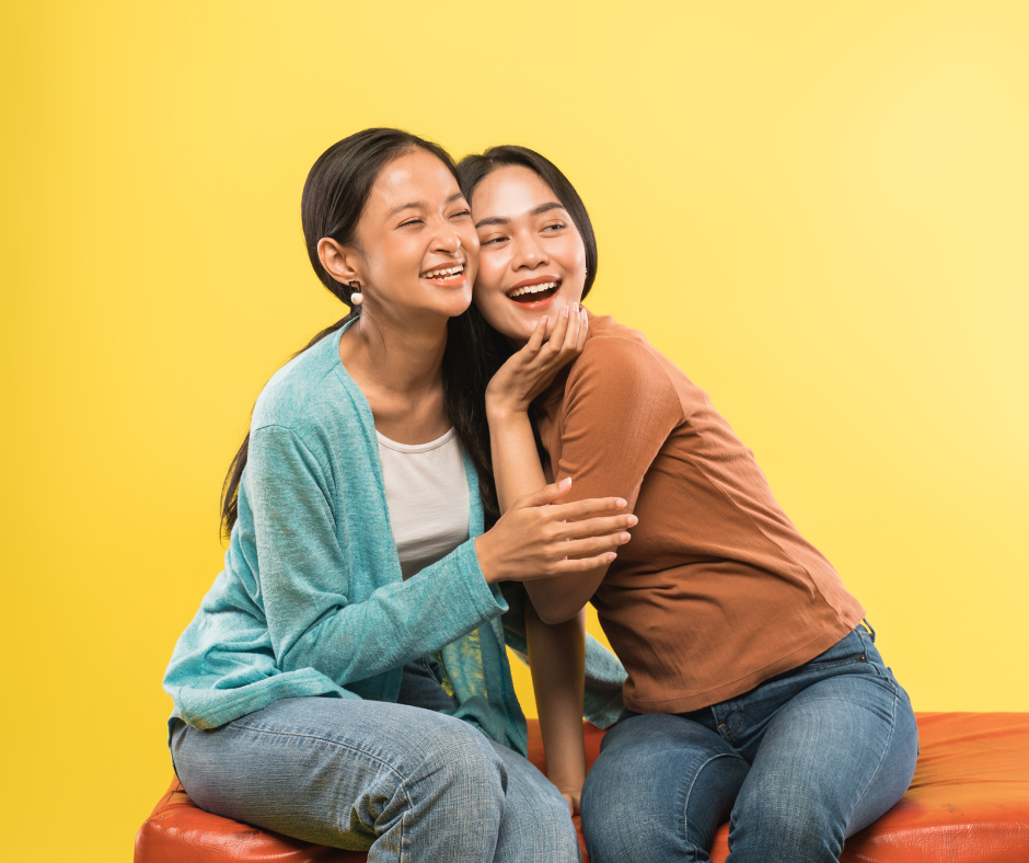 Side Effects of Donating Plasma - 2 happy women sitting on a bench